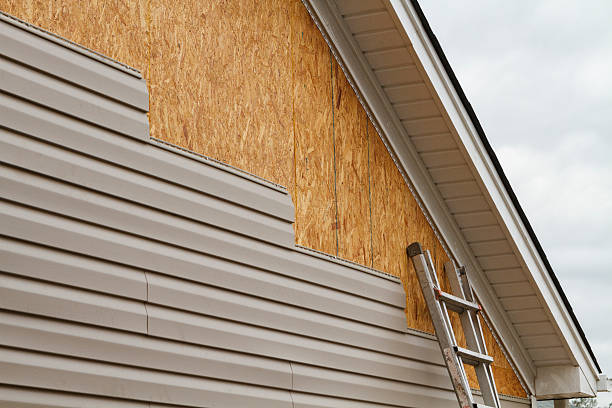Professional Storm Damage Siding Repair technician working in Kensington, CT